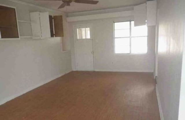 unfurnished room featuring ceiling fan