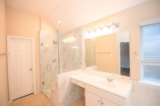 full bath with lofted ceiling, a marble finish shower, vanity, and tile patterned floors