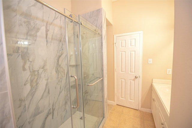 full bathroom featuring baseboards, a marble finish shower, vanity, and tile patterned floors