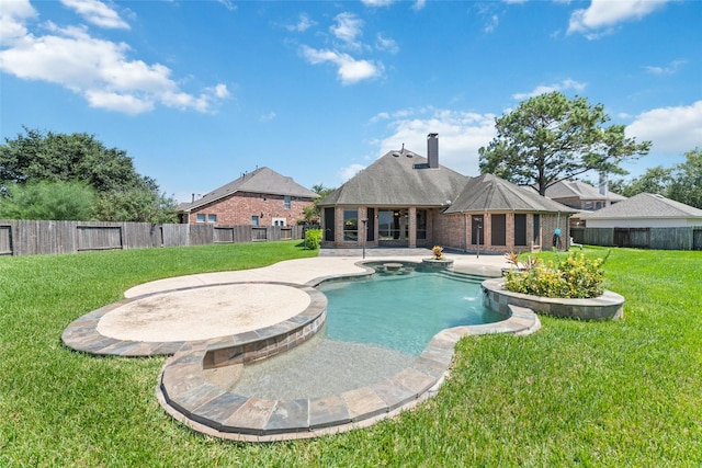 view of pool featuring a patio, a yard, and an in ground hot tub