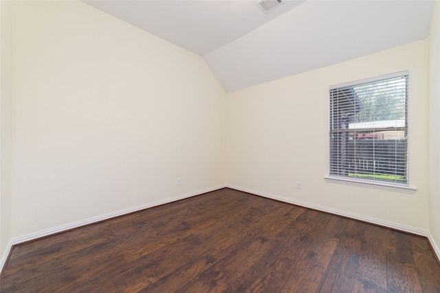 empty room with lofted ceiling and wood-type flooring