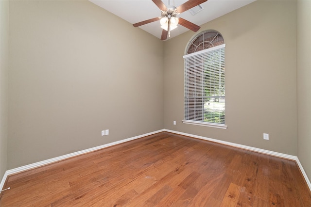 empty room featuring hardwood / wood-style flooring and ceiling fan