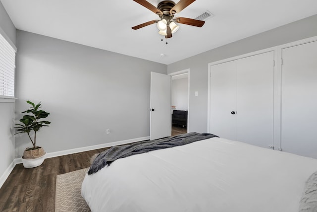 bedroom featuring dark hardwood / wood-style floors and ceiling fan