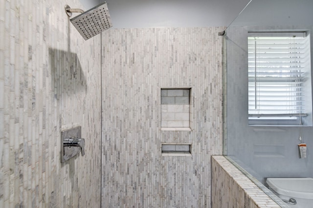 bathroom featuring tiled shower