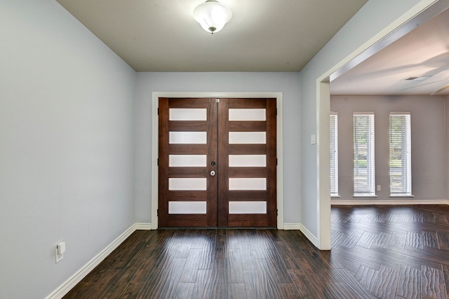 entryway featuring french doors and dark wood-type flooring