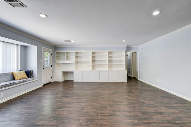 unfurnished living room with ornamental molding, dark wood-type flooring, and built in desk