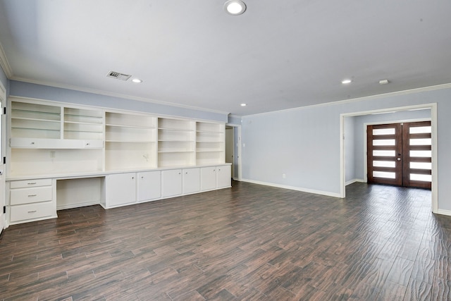 unfurnished living room with dark hardwood / wood-style flooring, crown molding, built in desk, and french doors