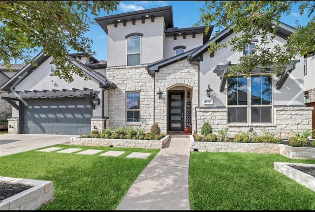 view of front of property with a garage and a front yard