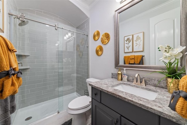 bathroom featuring crown molding, vanity, an enclosed shower, and toilet