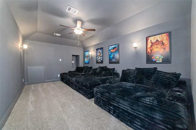 cinema room with ceiling fan, lofted ceiling, and carpet floors