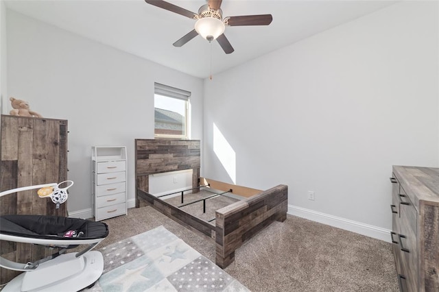 bedroom featuring light colored carpet and ceiling fan