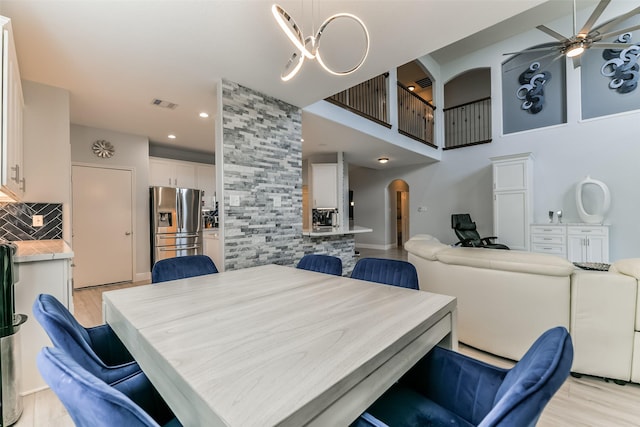 dining space featuring ceiling fan and light hardwood / wood-style floors