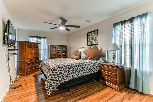 bedroom featuring light hardwood / wood-style flooring and ceiling fan