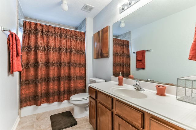 bathroom with tile patterned floors, vanity, and toilet