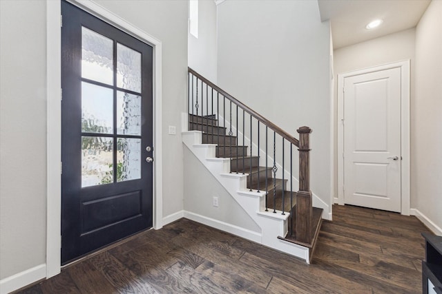 foyer with dark hardwood / wood-style floors