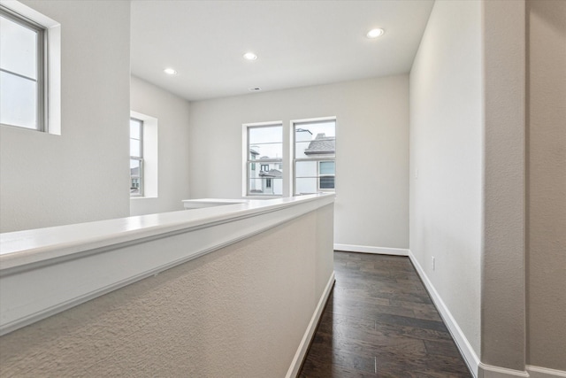 hall with dark hardwood / wood-style floors