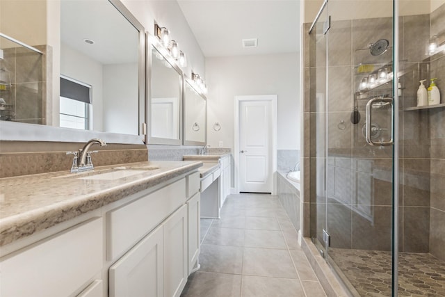 bathroom with vanity, tile patterned floors, and shower with separate bathtub