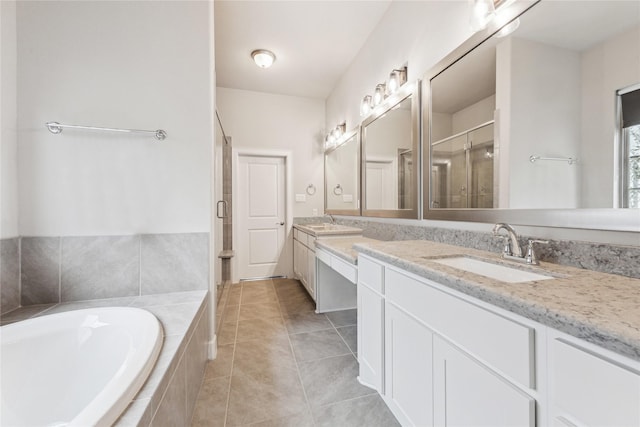 bathroom featuring tile patterned flooring, vanity, and separate shower and tub