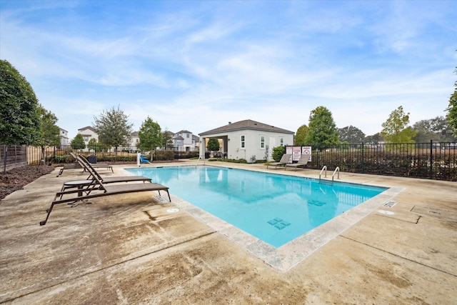 view of swimming pool with a patio area