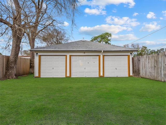 garage with a lawn