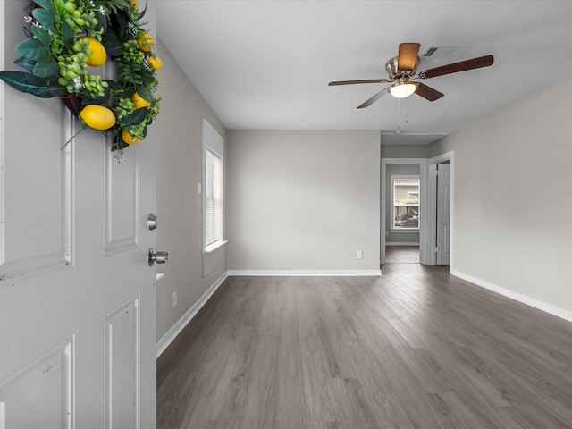 interior space featuring dark hardwood / wood-style flooring and ceiling fan