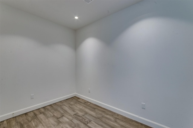 spare room featuring light hardwood / wood-style flooring