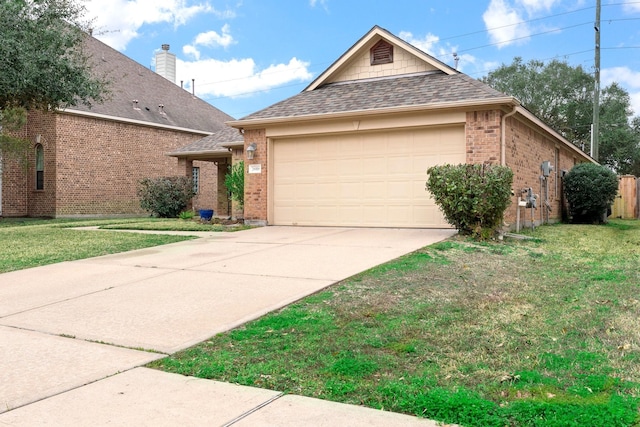 view of front facade with a garage and a front lawn