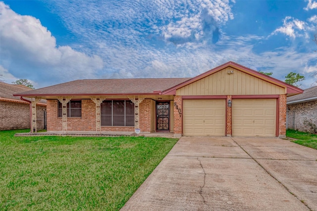 single story home featuring a garage and a front yard