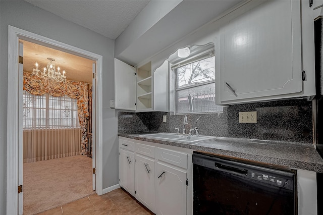 kitchen with white cabinetry, sink, a healthy amount of sunlight, and dishwasher