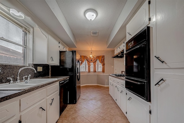 kitchen featuring white cabinetry, sink, black appliances, and exhaust hood