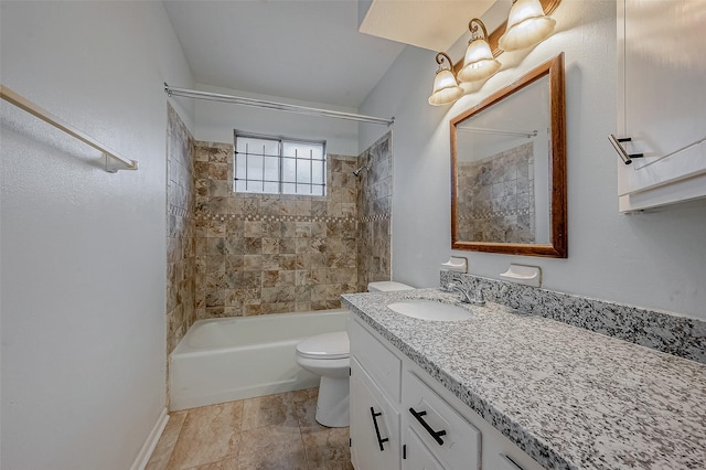 full bathroom with vanity, toilet, and tiled shower / bath