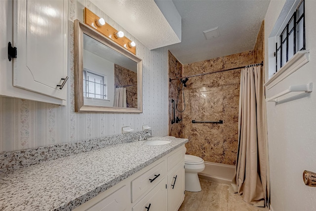 full bathroom with shower / bath combination with curtain, vanity, toilet, and a textured ceiling