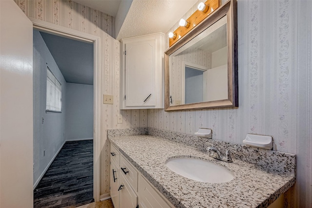 bathroom featuring hardwood / wood-style flooring and vanity