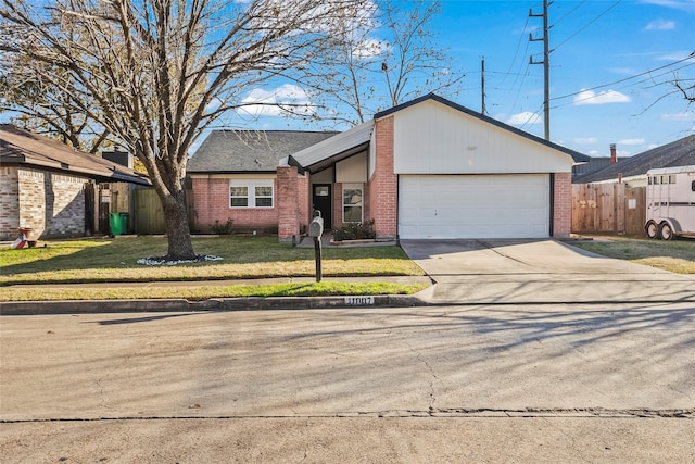 single story home with a garage and a front lawn