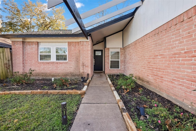 entrance to property featuring a pergola