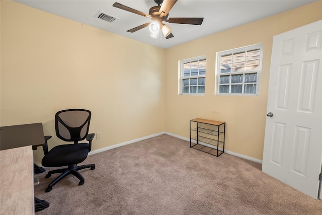 home office with ceiling fan and light colored carpet