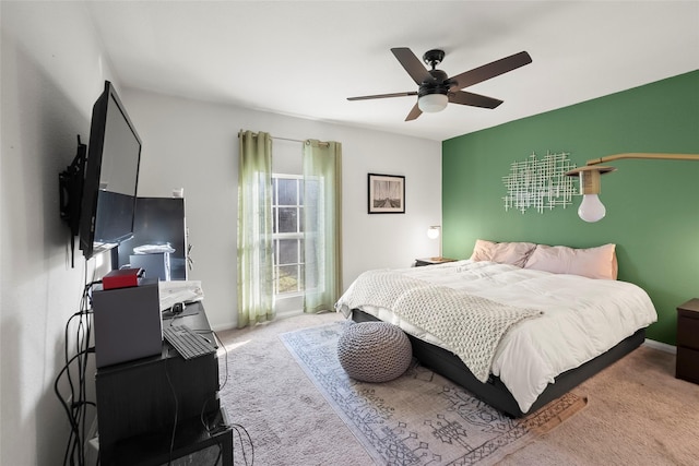 bedroom with light carpet and ceiling fan