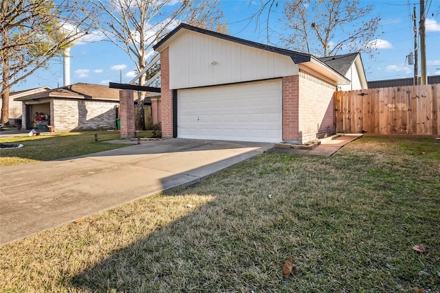 view of side of home featuring a garage and a lawn