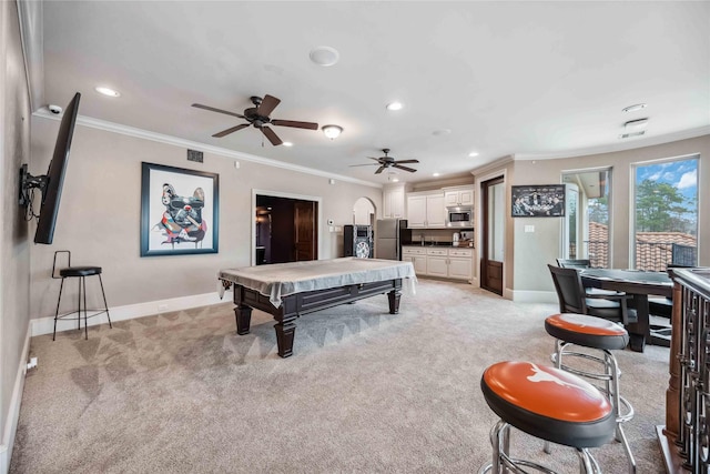 playroom with pool table, ornamental molding, and light carpet