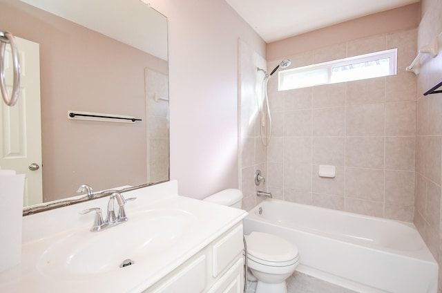 full bathroom with vanity, tiled shower / bath combo, and toilet