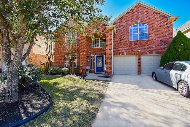 view of front property featuring a garage and a front yard