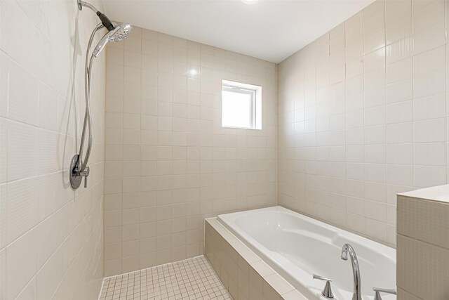 bathroom featuring tile patterned floors, independent shower and bath, and tile walls