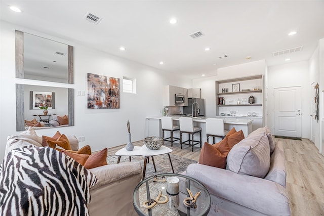 living room with light hardwood / wood-style floors