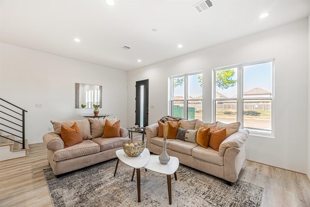 living room with light hardwood / wood-style flooring