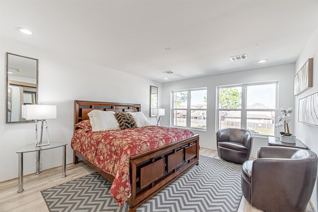 bedroom with hardwood / wood-style floors