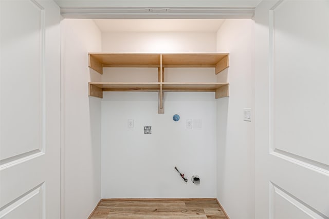 laundry area with hookup for a washing machine, gas dryer hookup, electric dryer hookup, and light hardwood / wood-style flooring