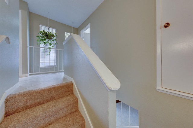 stairway featuring tile patterned floors