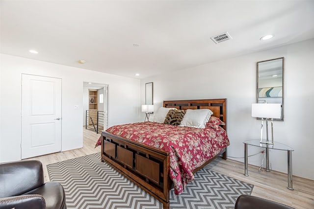 bedroom featuring recessed lighting, visible vents, and light wood-style flooring