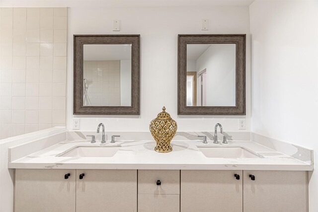 full bath featuring a sink and double vanity