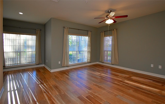 unfurnished room featuring hardwood / wood-style flooring and ceiling fan